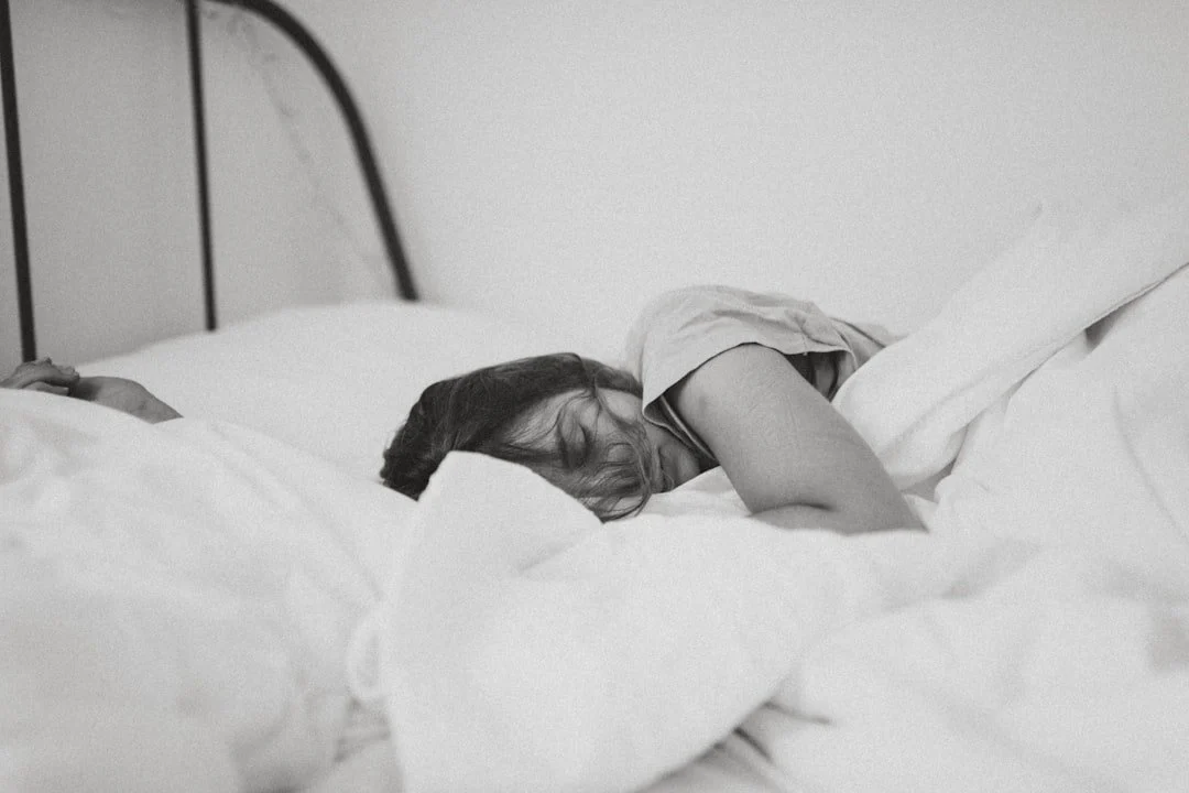 Laying-in-Bed-Depression-1080x720-unsplashwebp Woman lying in bed in depression